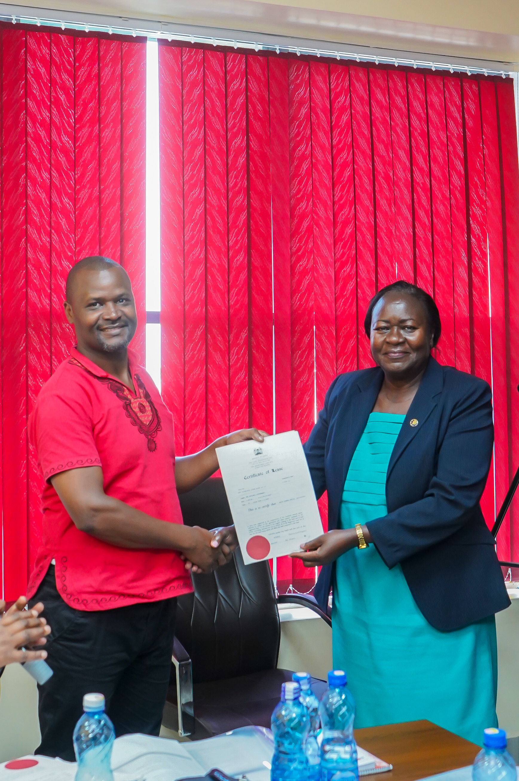 Members Receiving Title Deeds